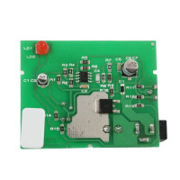Green PCB with a barrel plugin site on the side and a red LED